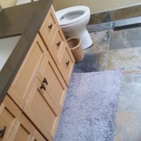 Ray Newkirk General Contractor: Custom rift sawn oak Shaker vanity & slate floor throughout bathroom, kitchen & living area
